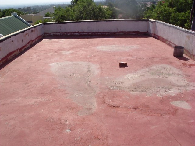 Flat cement roof BEFORE